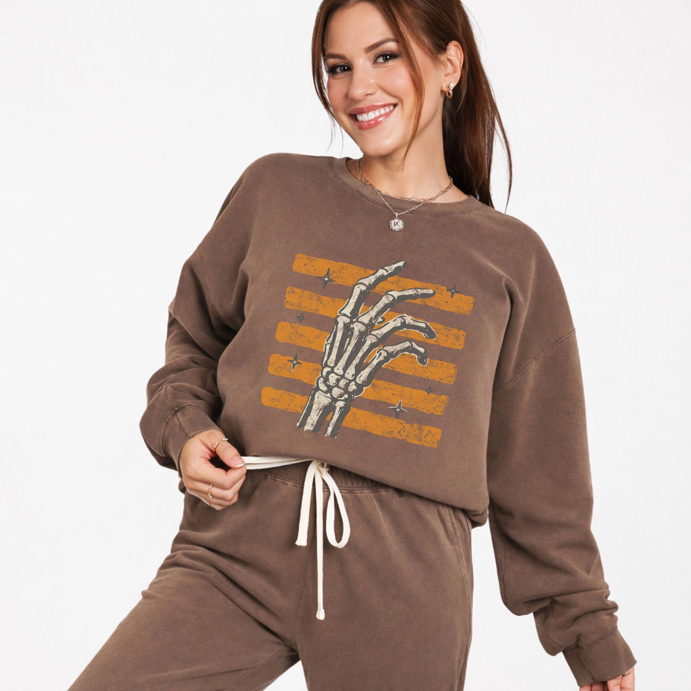 Simply Sage Market - Women's Lightweight Garment Dyed Sweatshirt Skeleton Hand Orange Stripes