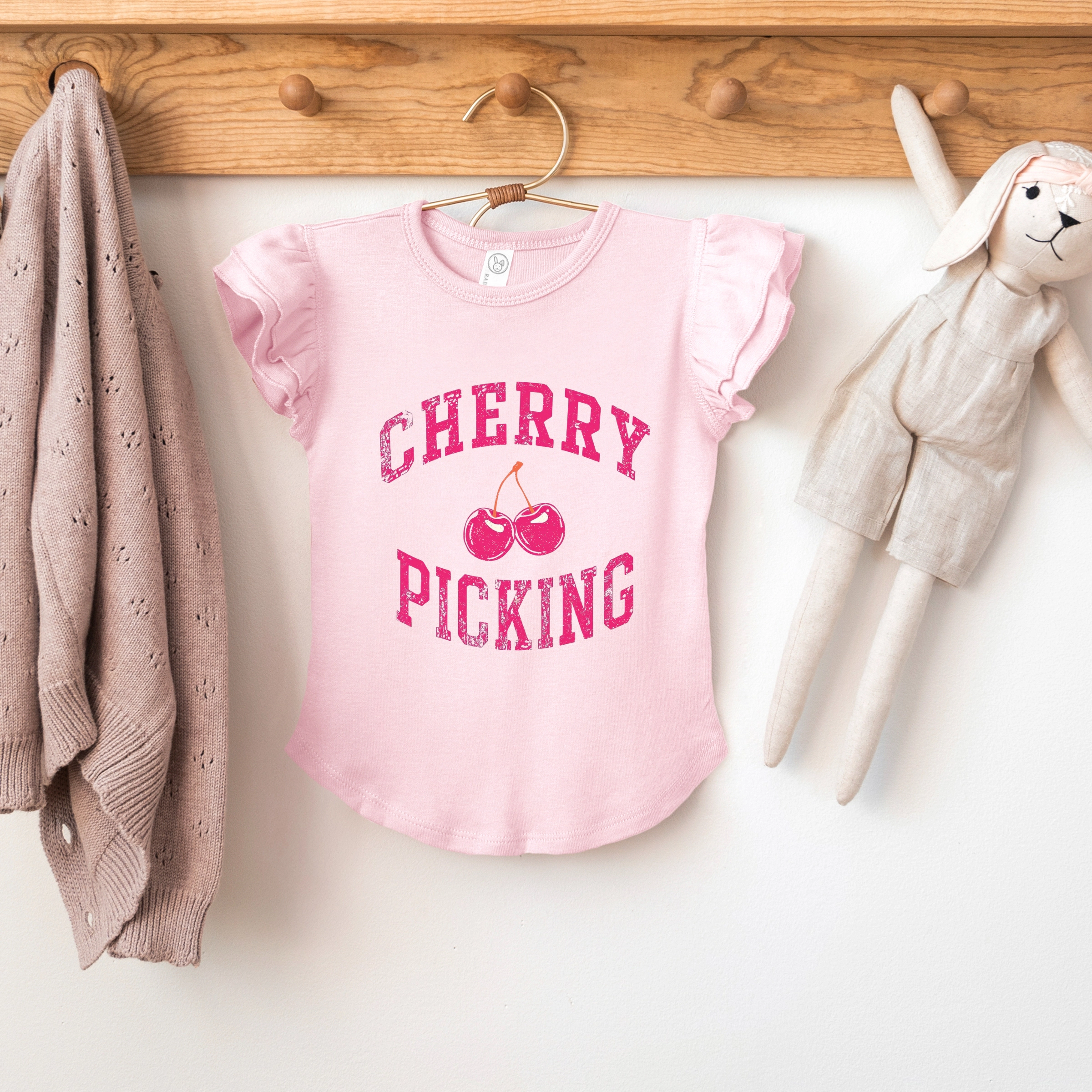 The Juniper Shop Girl's - Cherry Picking Varsity Arched Flutter Sleeve Graphic T-Shirt