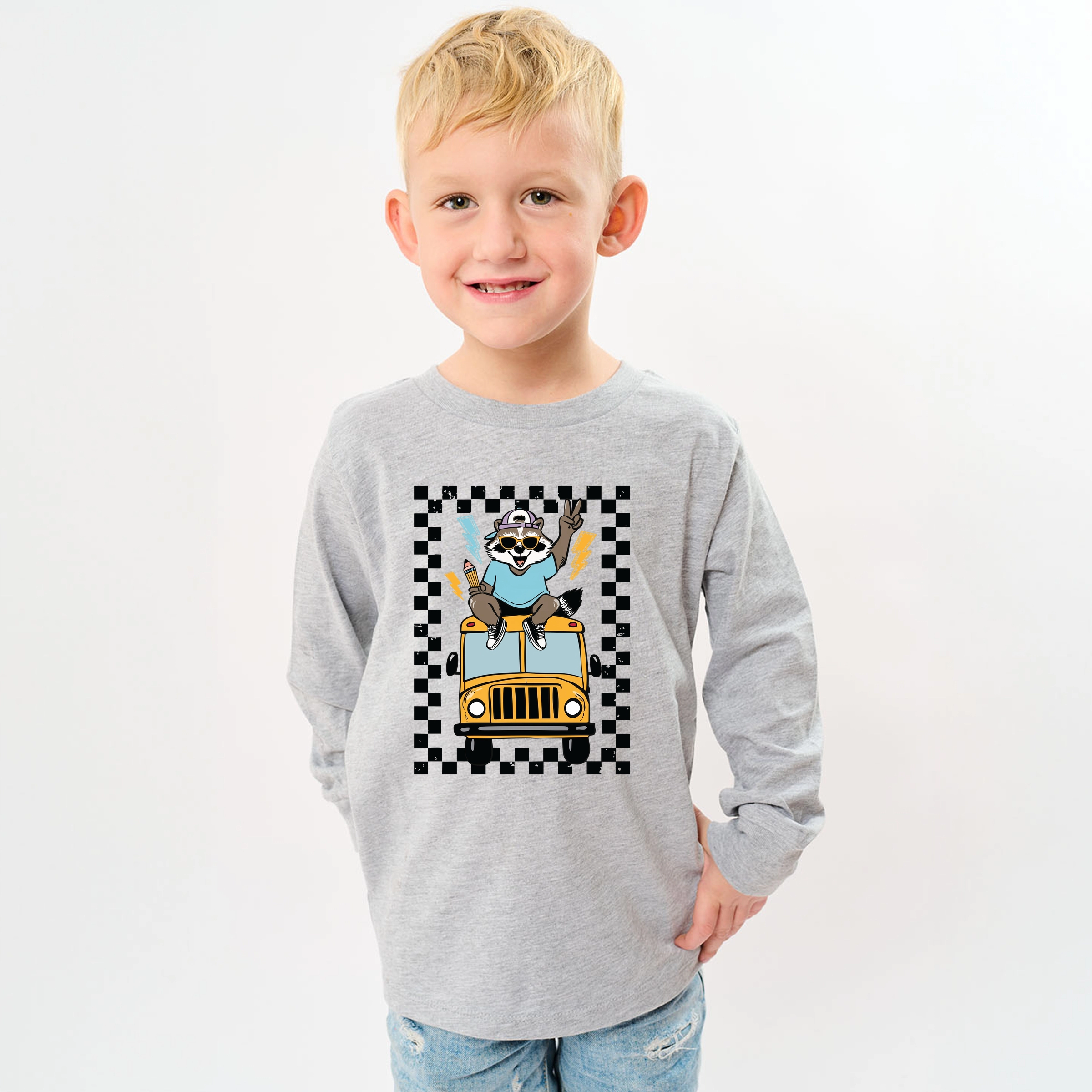 The Juniper Shop - Youth Long Sleeve Graphic T-Shirt Racoon School Bus Lightning
