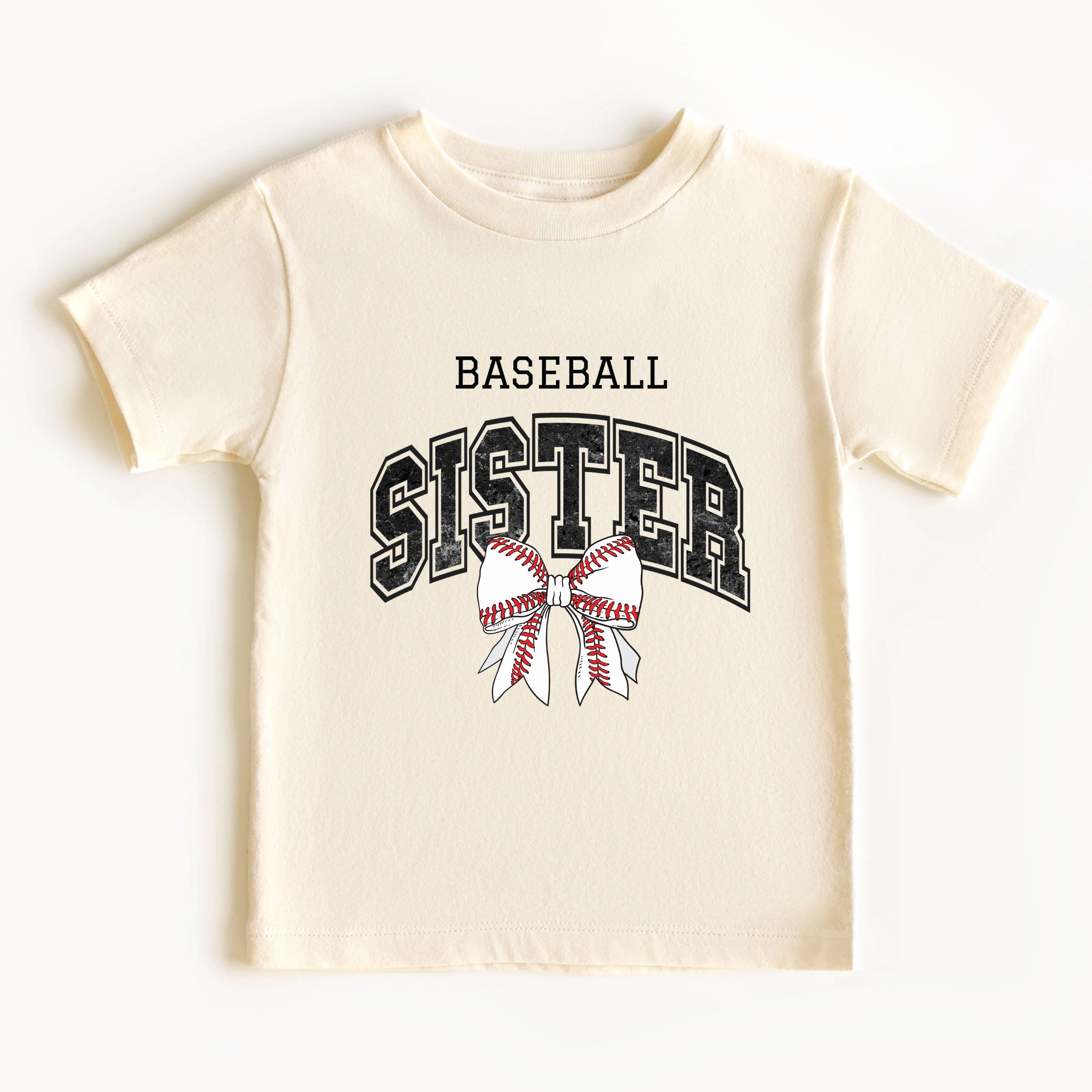 The Juniper Shop - Baseball Sister Varsity Coquette Toddler Short Sleeve Graphic T-Shirt