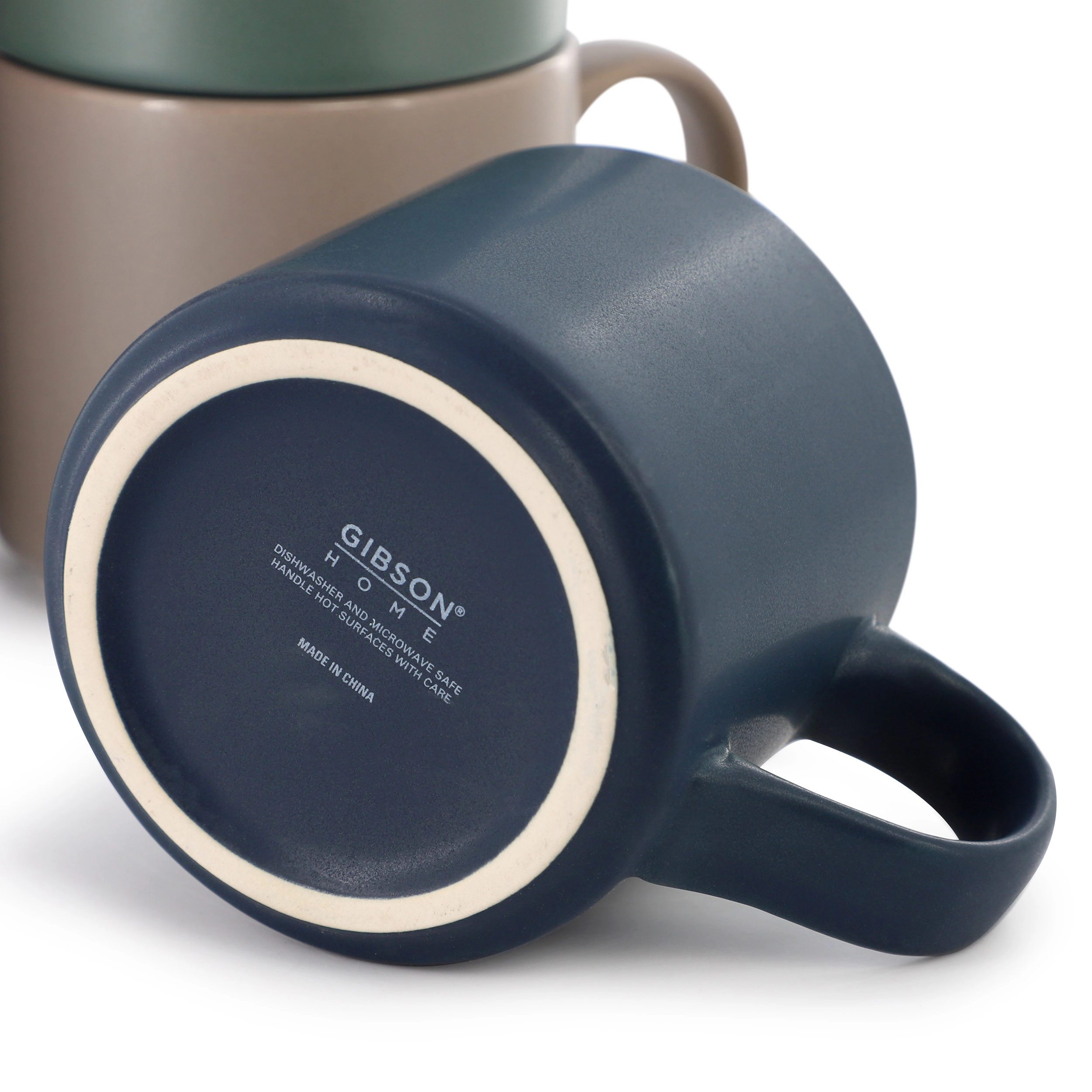 Gibson Home Dutch Yard 7 Piece 16oz Stoneware Mug Set with Metal Rack in Multi-Color