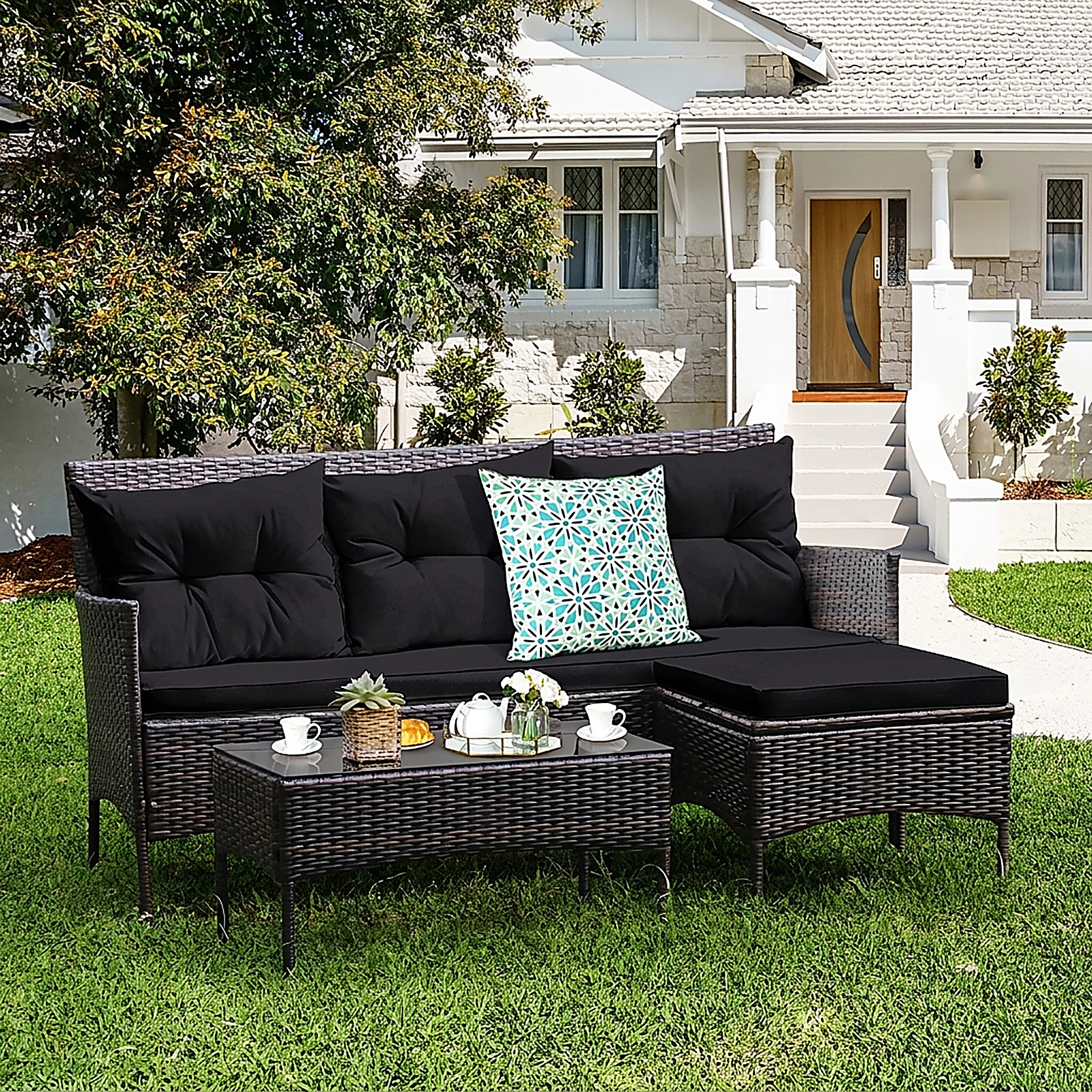 SUGIFT 3-Piece Black Rattan Outdoor Sofa Set with Ottoman, Glass Coffee Table and 5 Cushions