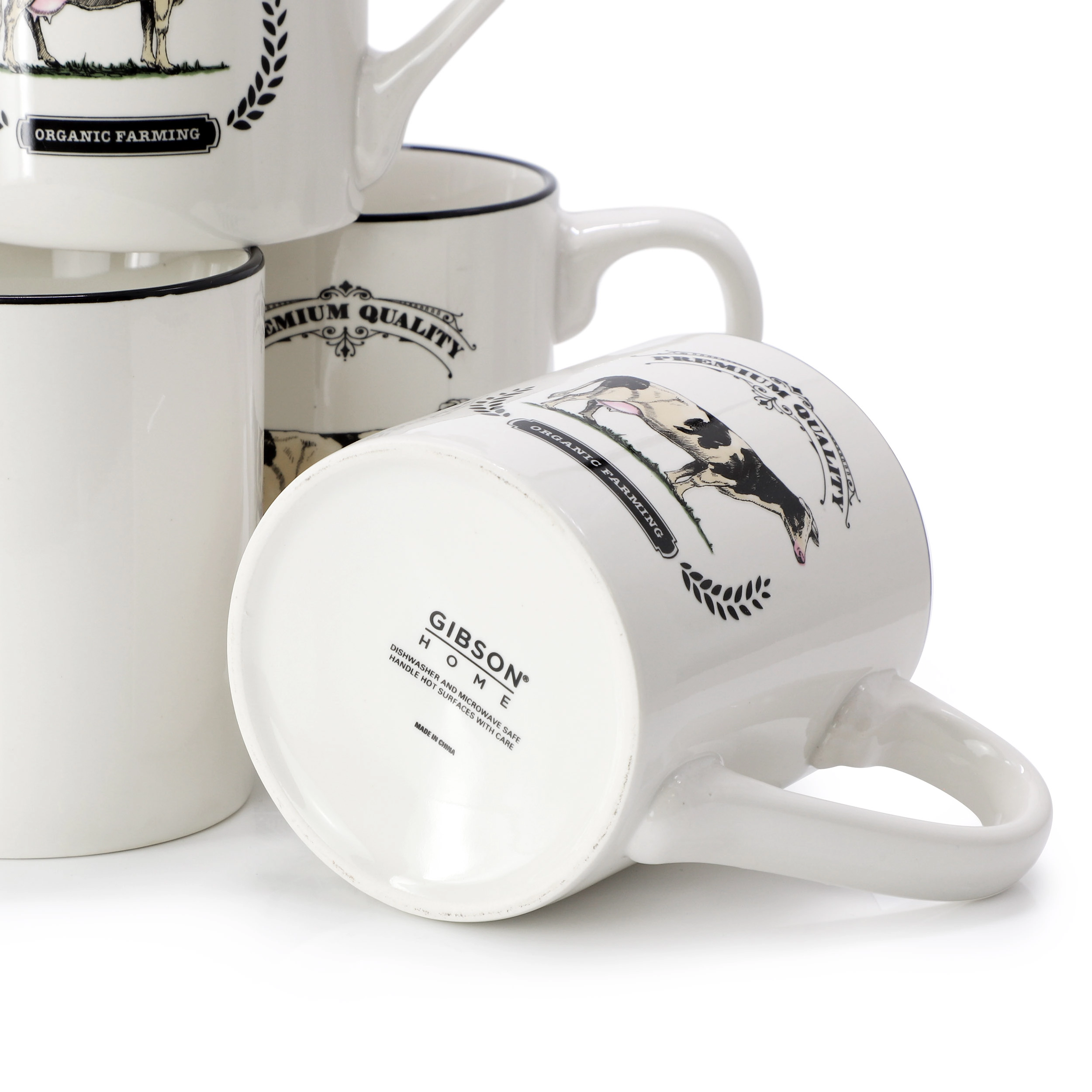 Gibson Home Barn Animals 8 Piece 17 Ounce Decorated Cow Mugs in White and Black