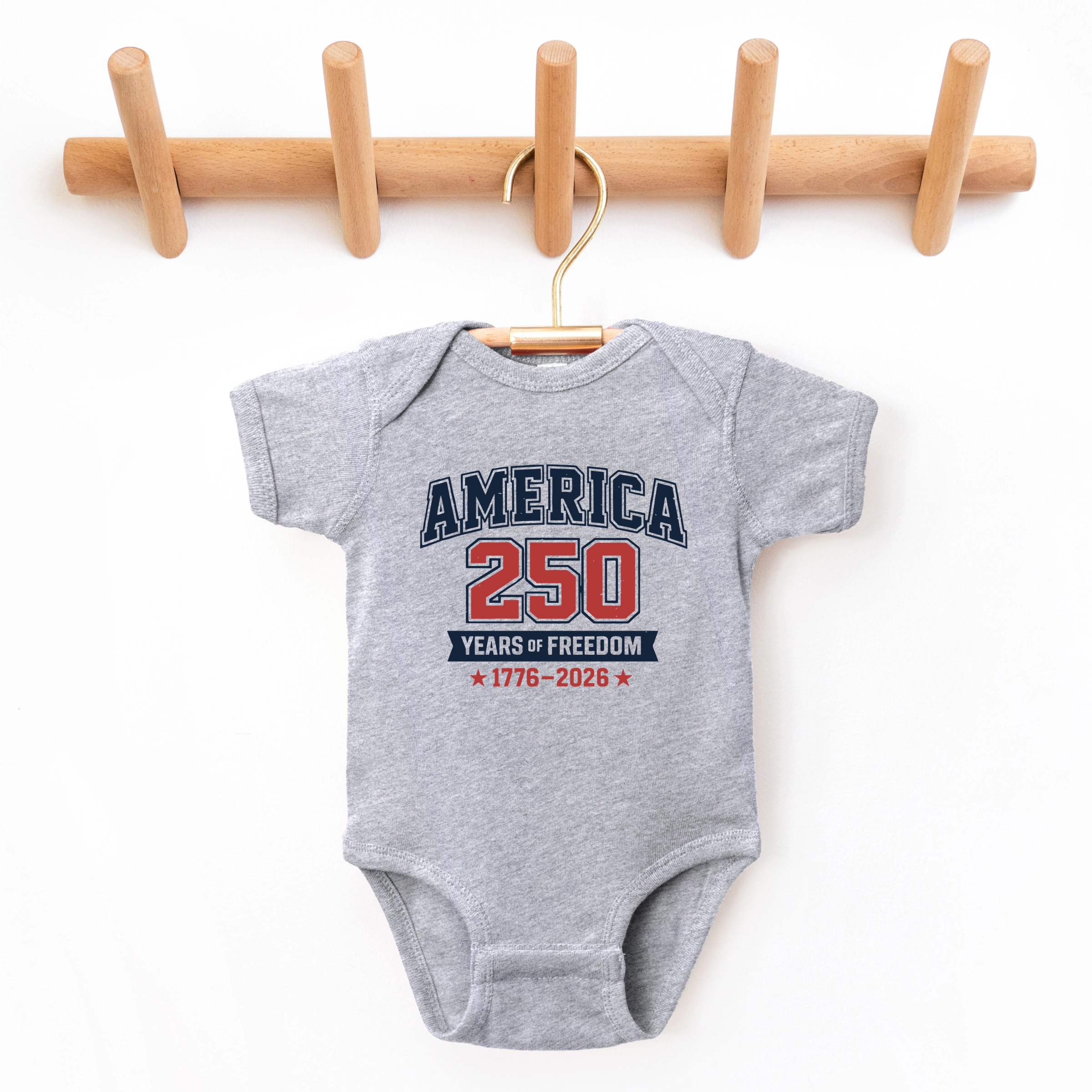 The Juniper Shop - America 250 Years of Freedom Varsity Baby Short Sleeve Graphic Bodysuit