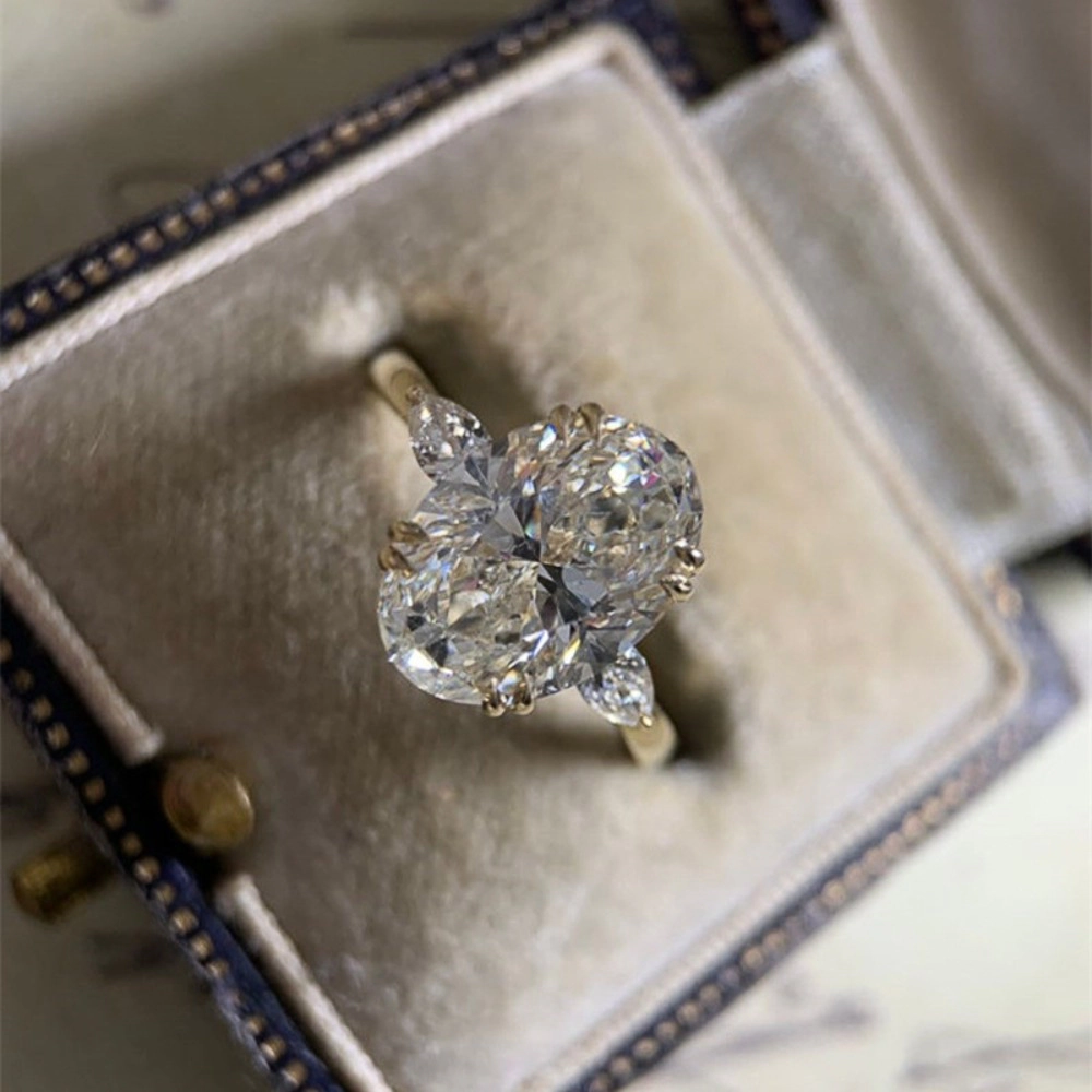 Wardrobe Whimsy Oval Cut Cubic Zirconia Three Stone Engagement Ring for Women