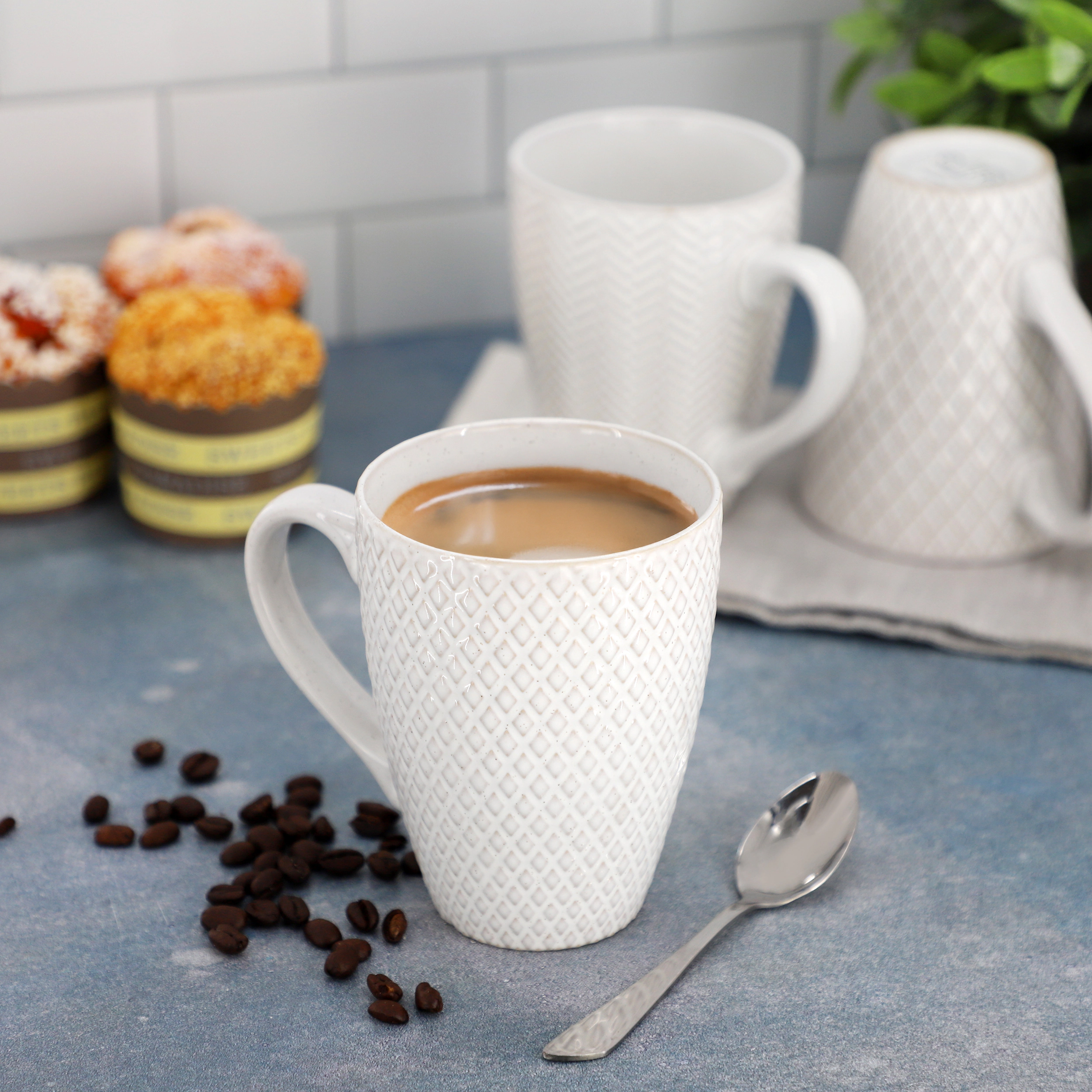 Gibson Elite Earlhart 4 Piece 16 Ounce Stoneware Assorted Pattern Mug Set in White