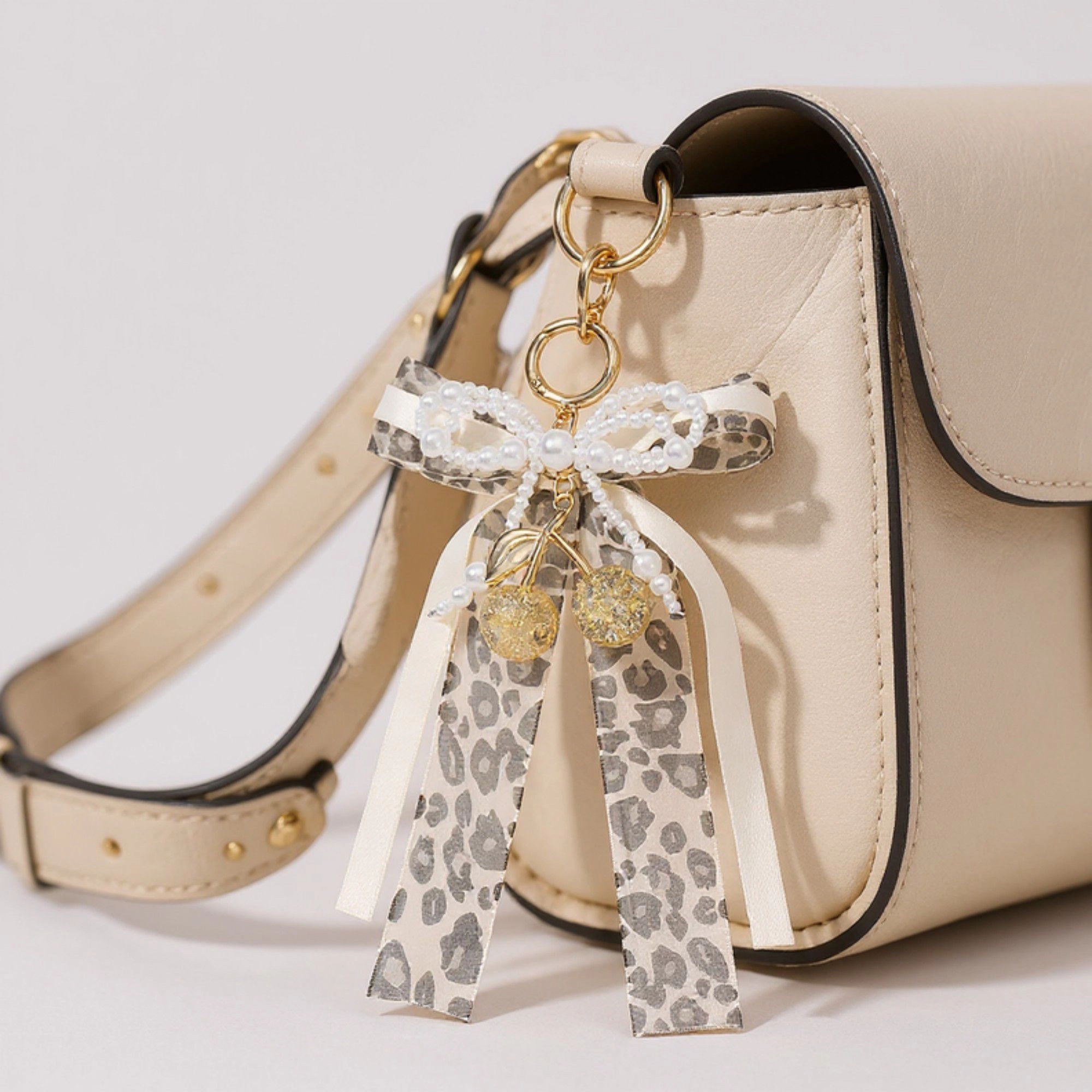 Alilang Women's Fashion Leopard Print Ribbon Keychain with Pearl Bow and Cherry Charms