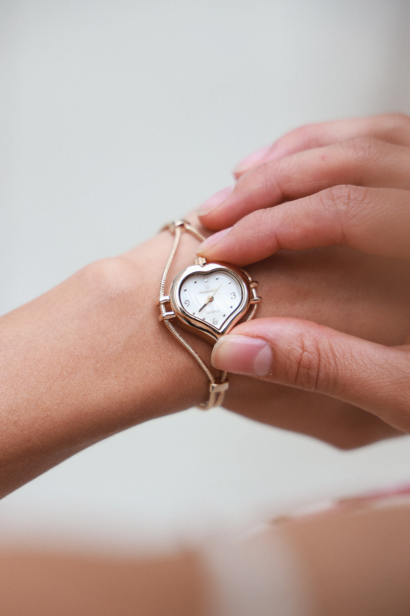 Peugeot Womens Gold-Tone Heart Shape Wire Watch with Mother of Pearl dial