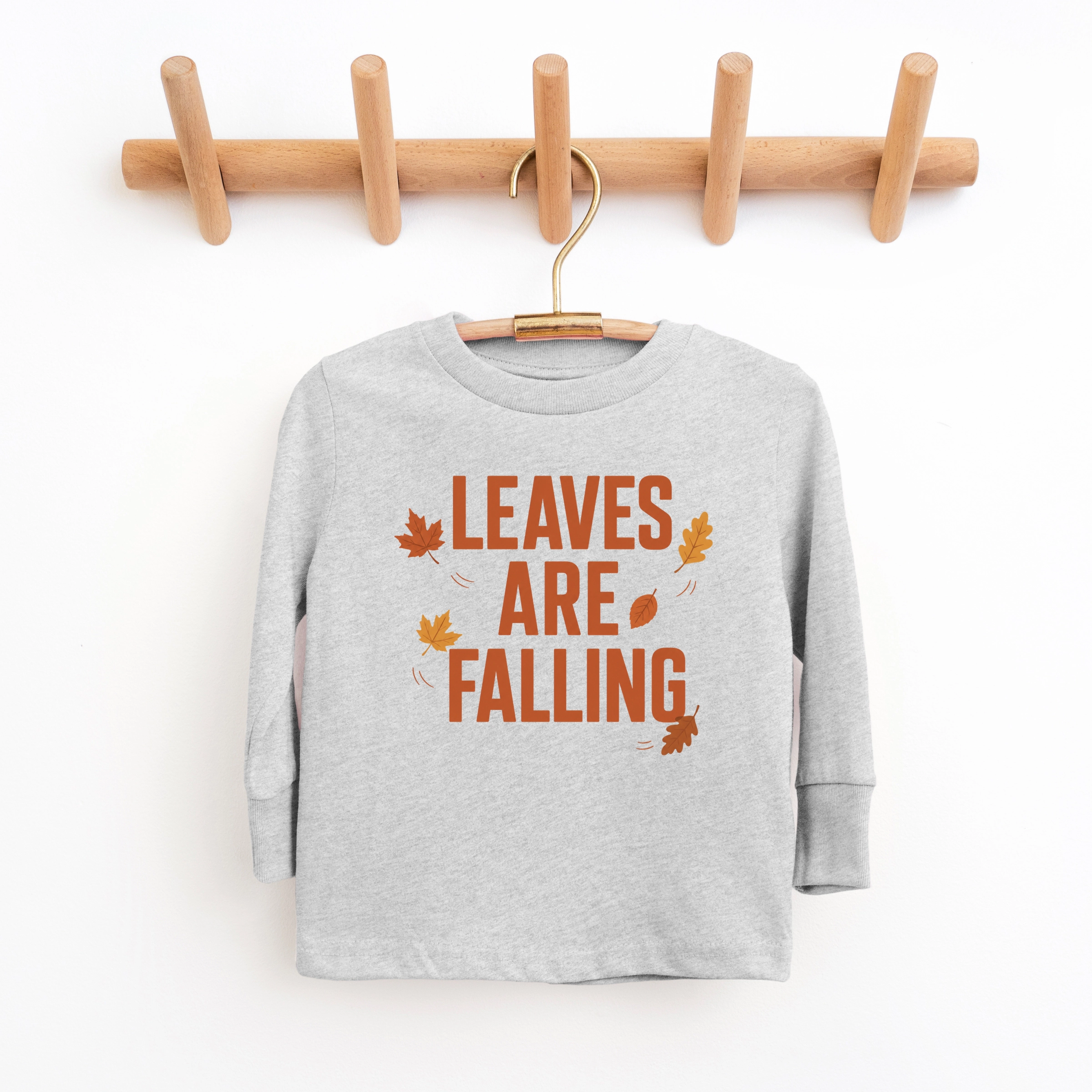 The Juniper Shop - Youth Long Sleeve Graphic T-Shirt Leaves Are Falling Orange