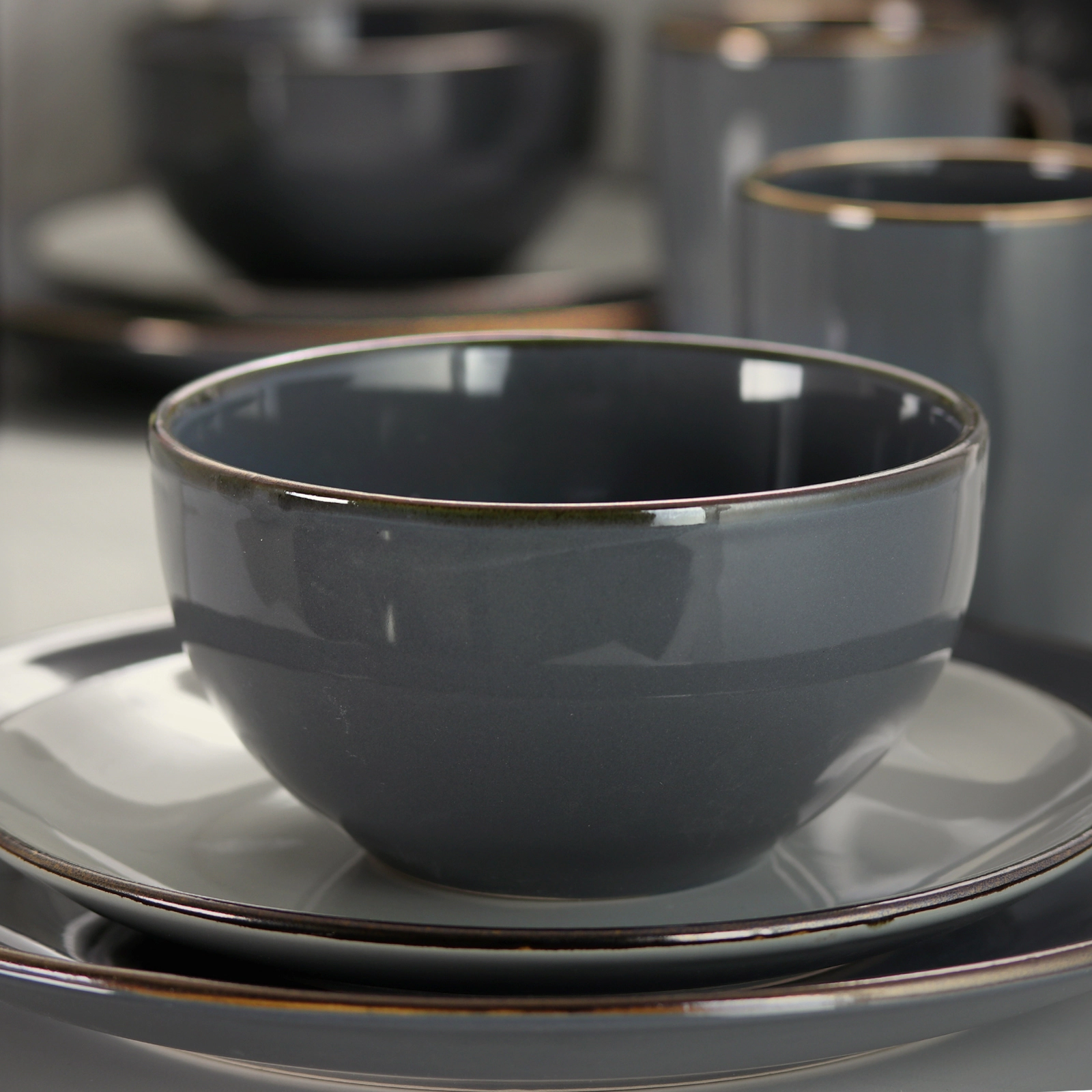 Elama Tahitian Grand 16 Piece Stoneware Dinnerware Set in Gray