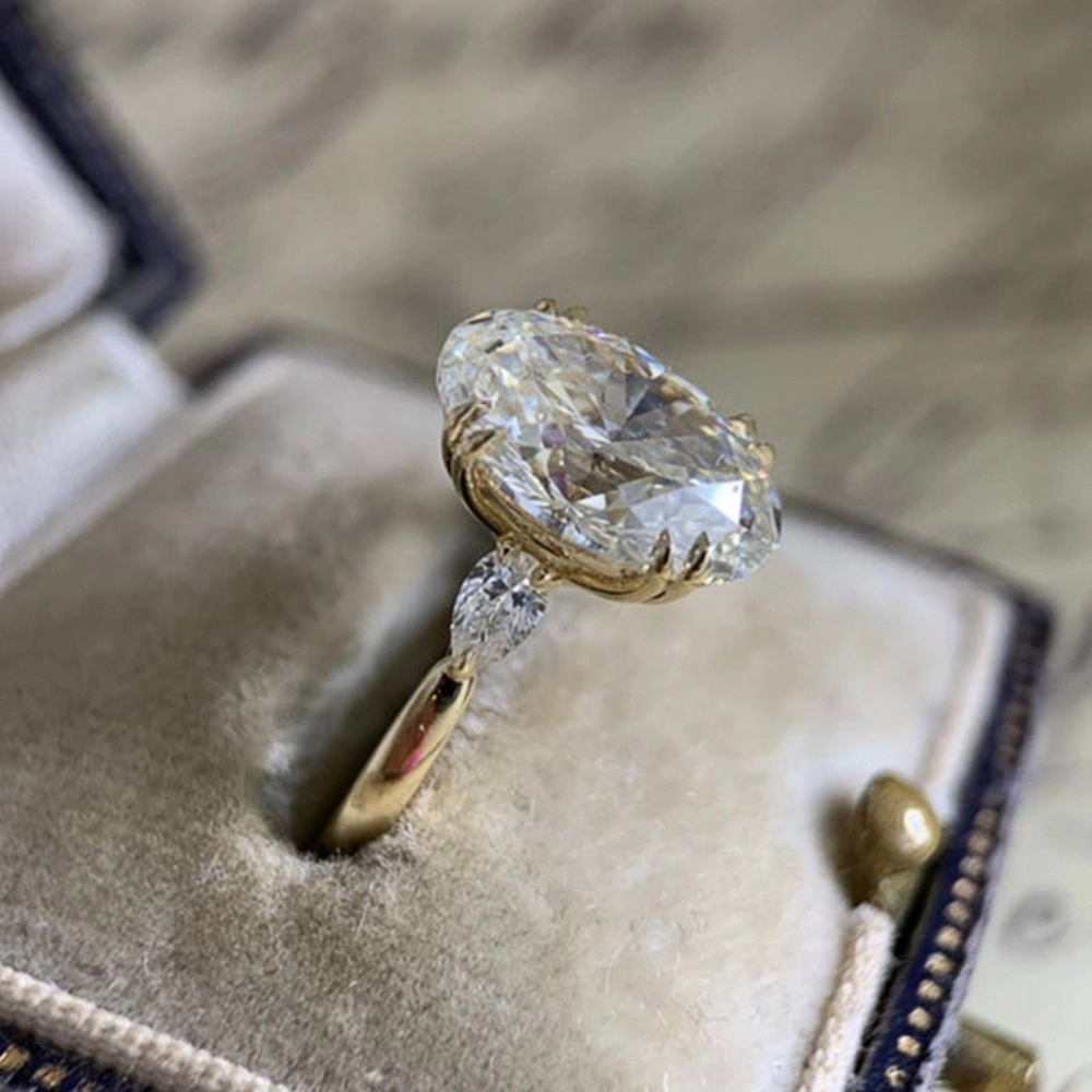 Wardrobe Whimsy Oval Cut Cubic Zirconia Three Stone Engagement Ring for Women