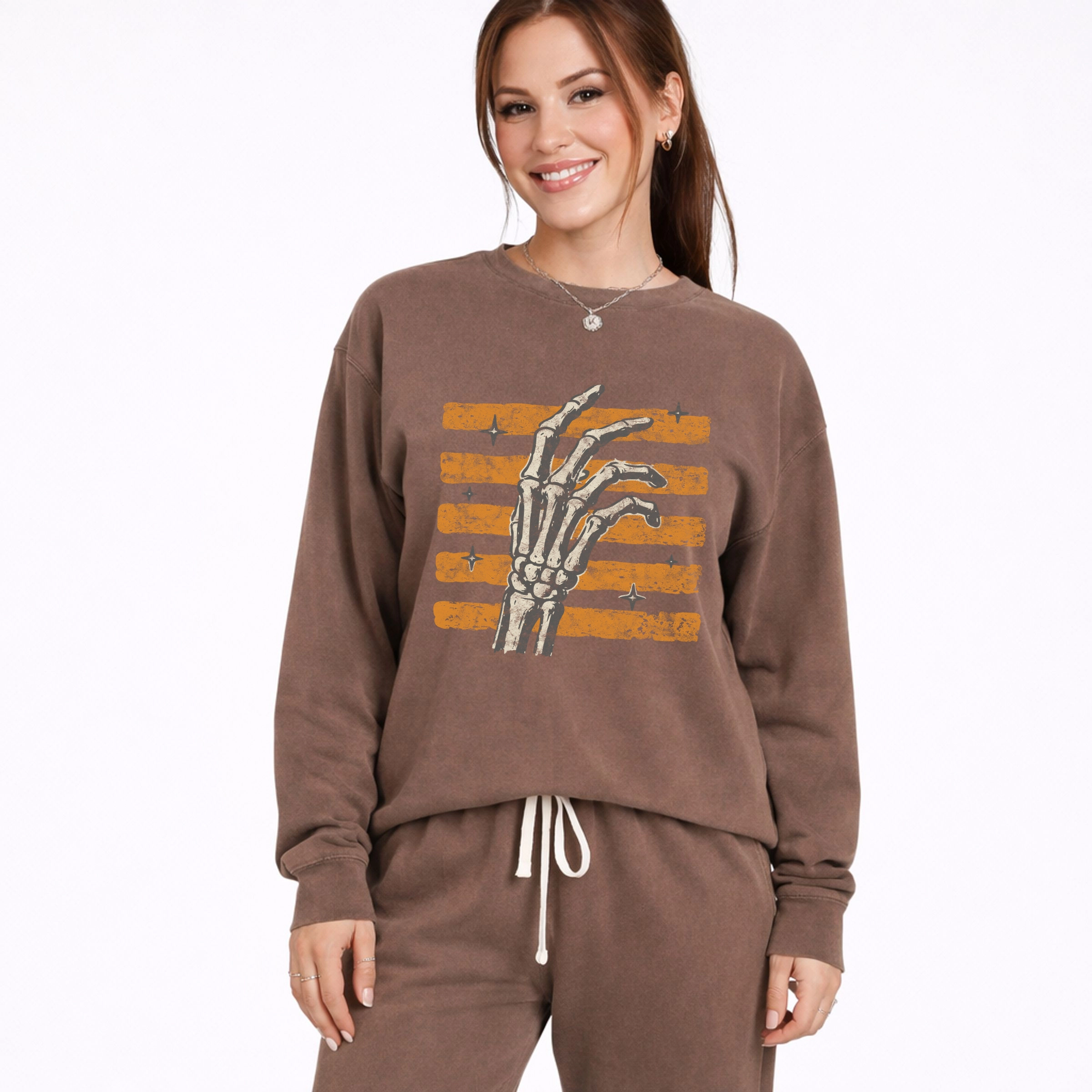 Simply Sage Market - Women's Lightweight Garment Dyed Sweatshirt Skeleton Hand Orange Stripes