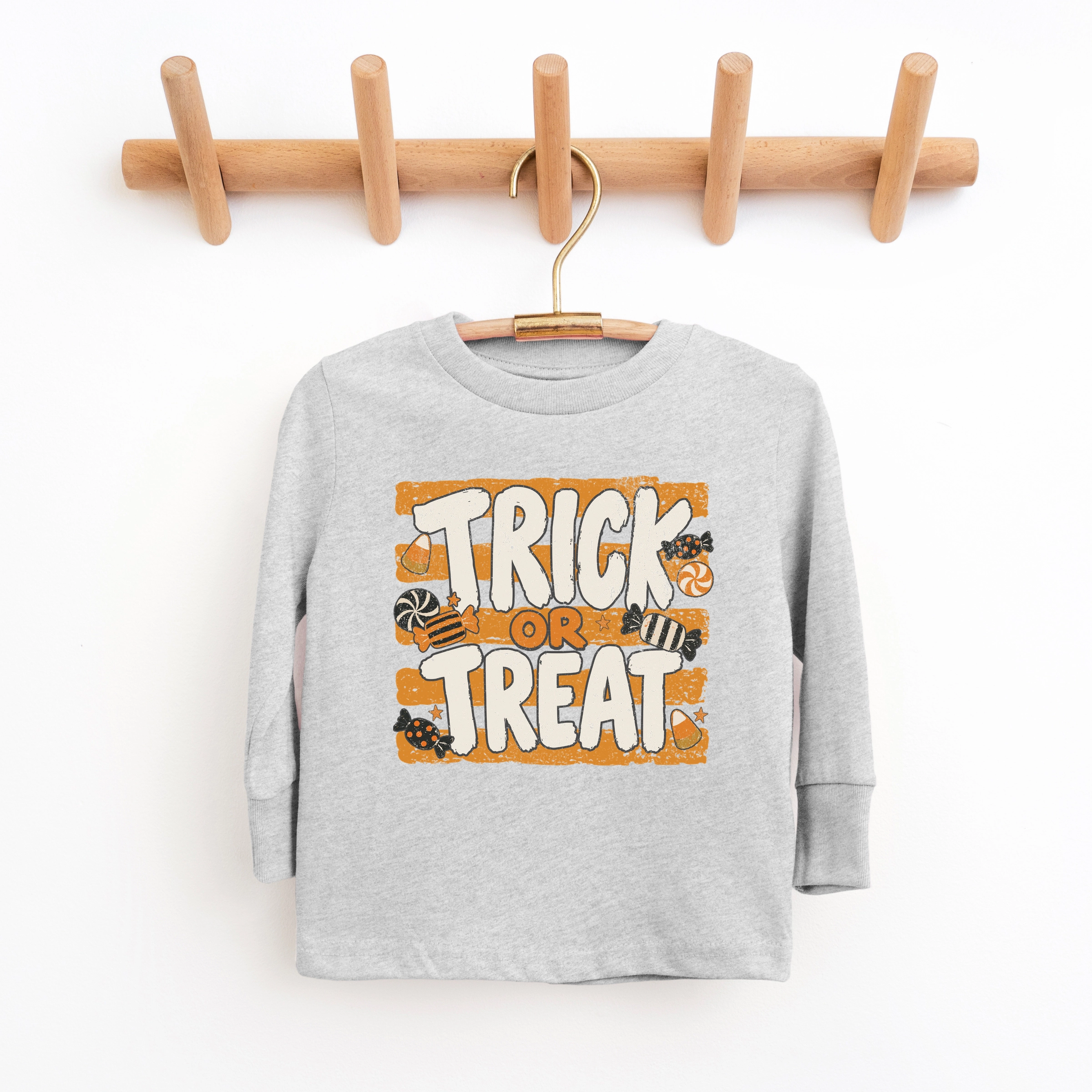 The Juniper Shop - Youth Long Sleeve Graphic T-Shirt Trick or Treat Orange Stripes