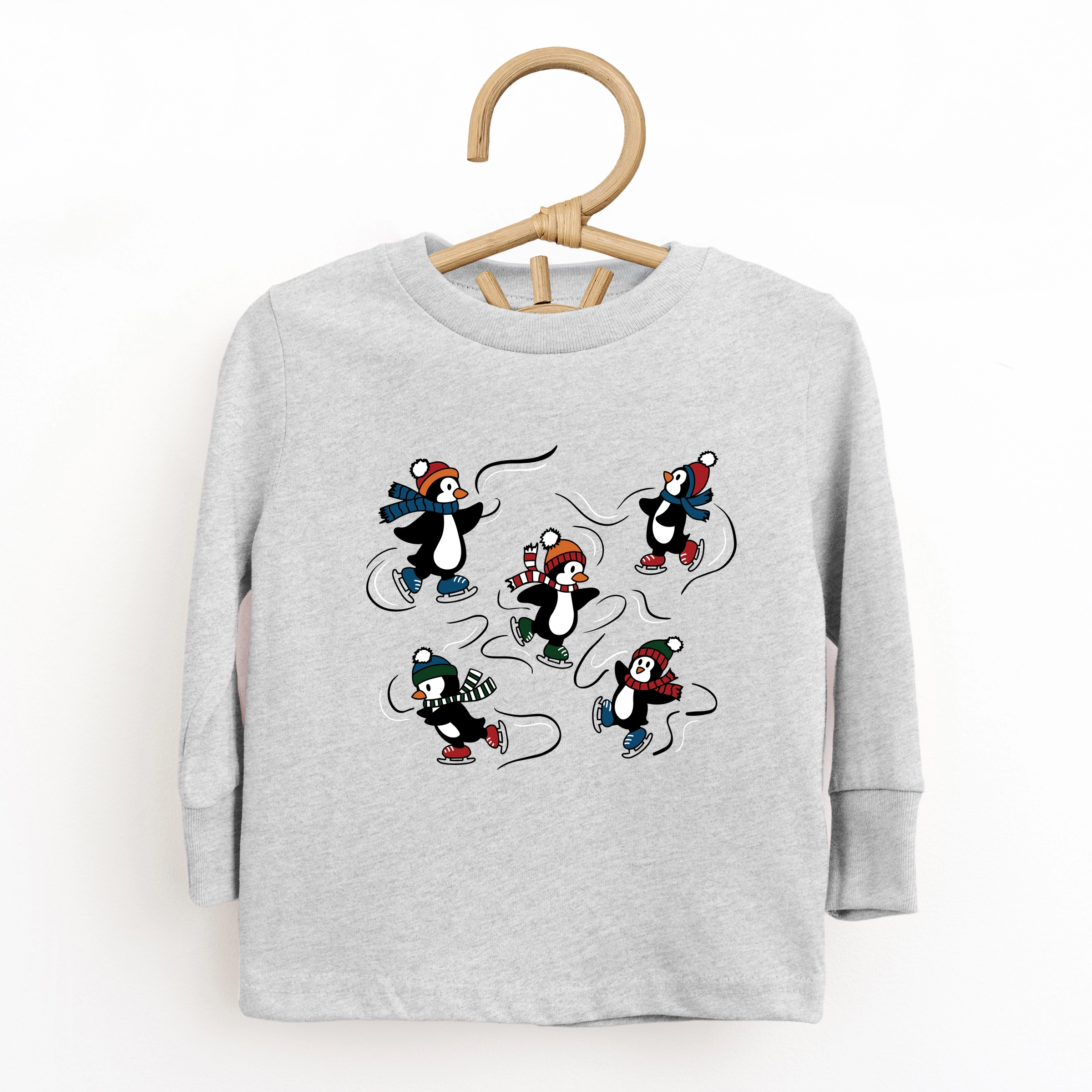 The Juniper Shop - Toddler Long Sleeve Graphic Tee Ice Skating Penguins