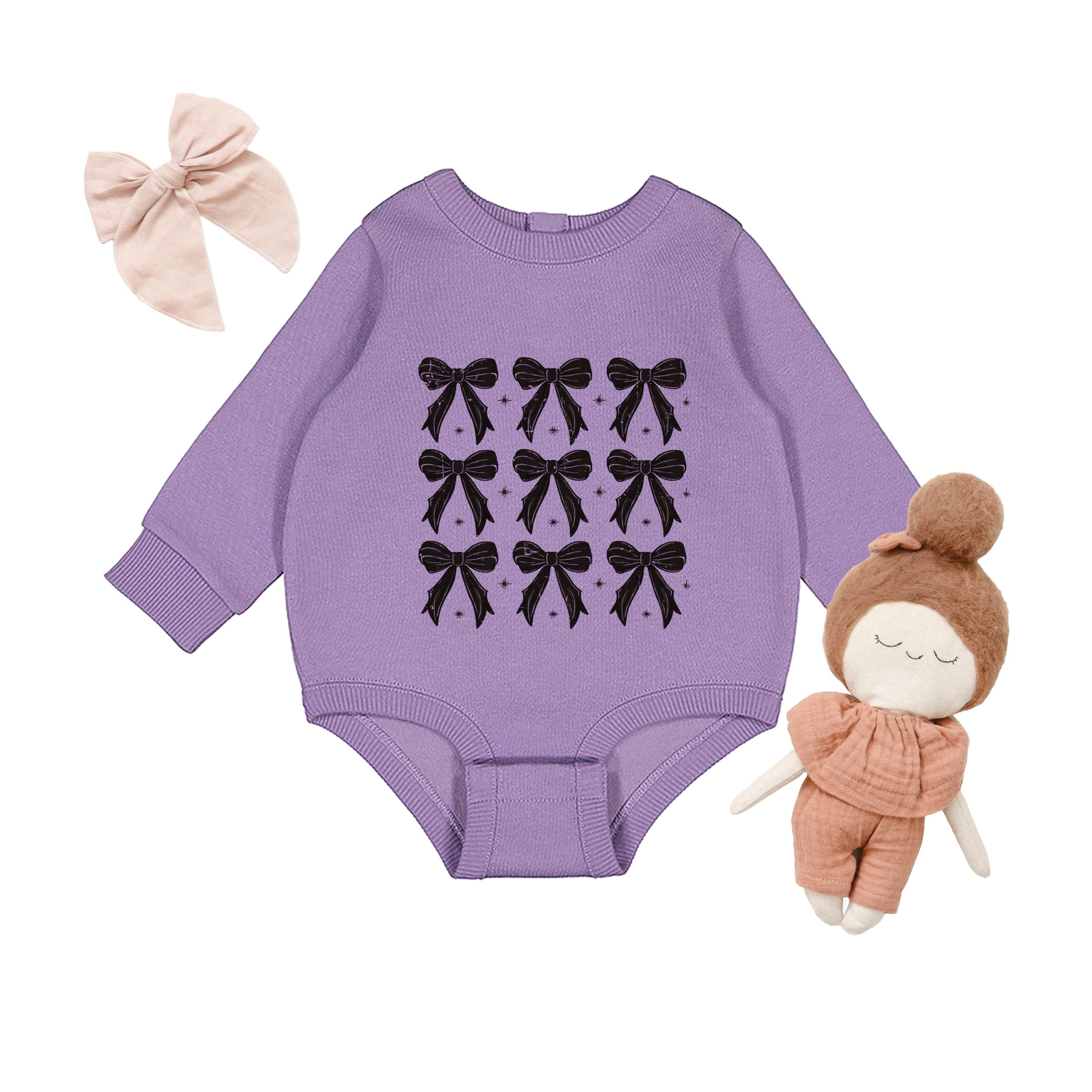 The Juniper Shop - Infant Fleece BodySuit Coquette Black Bows Collage Distressed