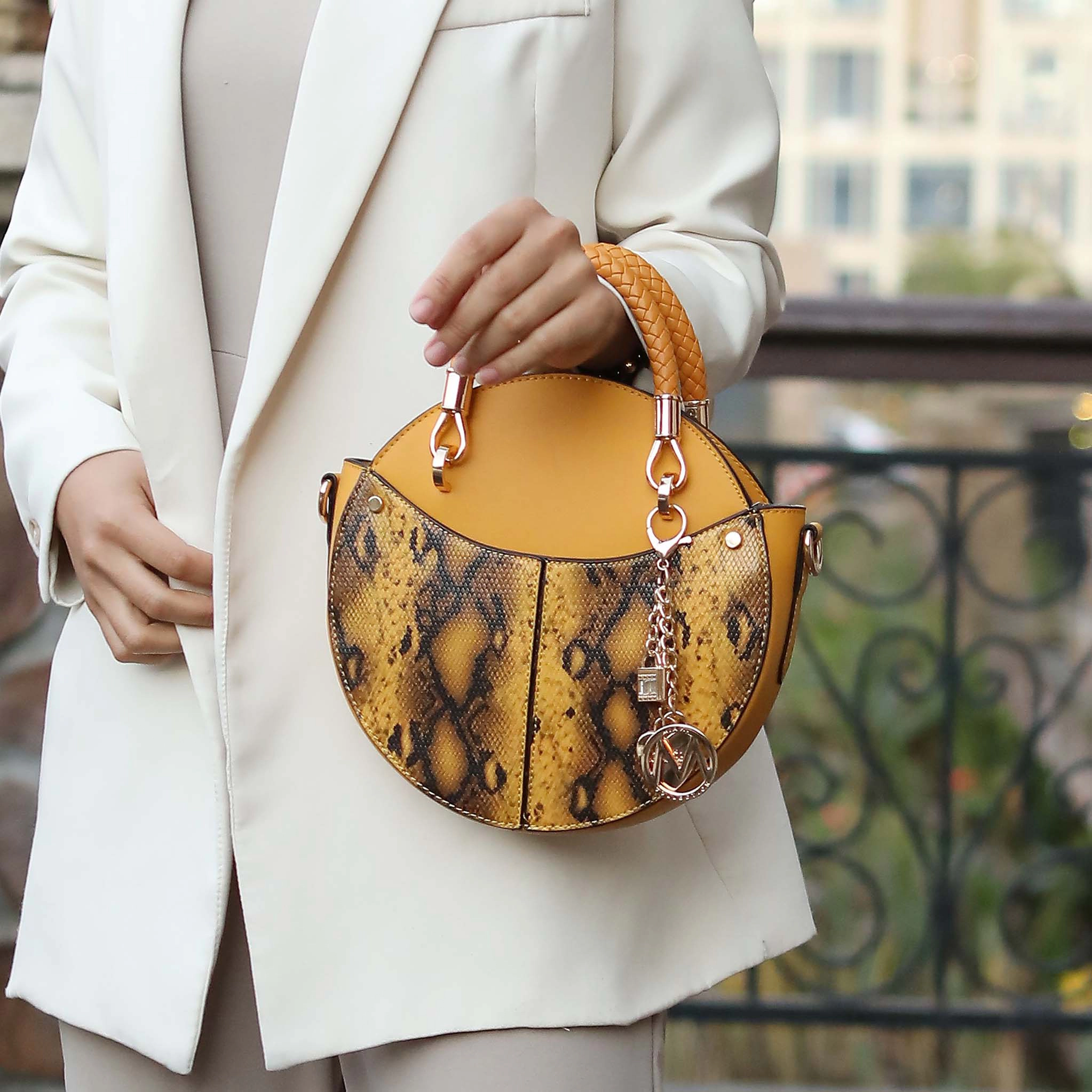 MKF Collection by Mia K Camille Round Crossbody Bag - Snake Embossed Vegan Leather, Mustard