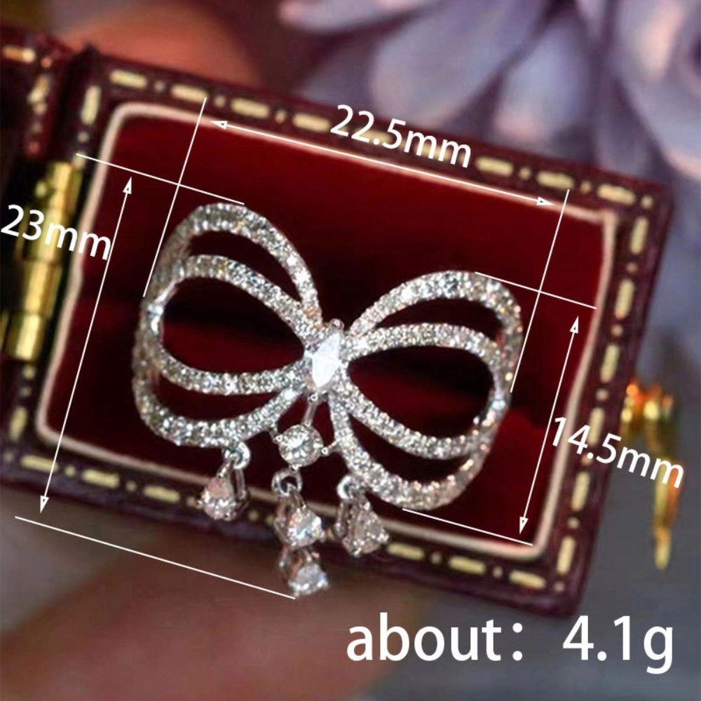Wardrobe Whimsy Bow Shape Dangling Cubic Zirconia Statement Ring for Women