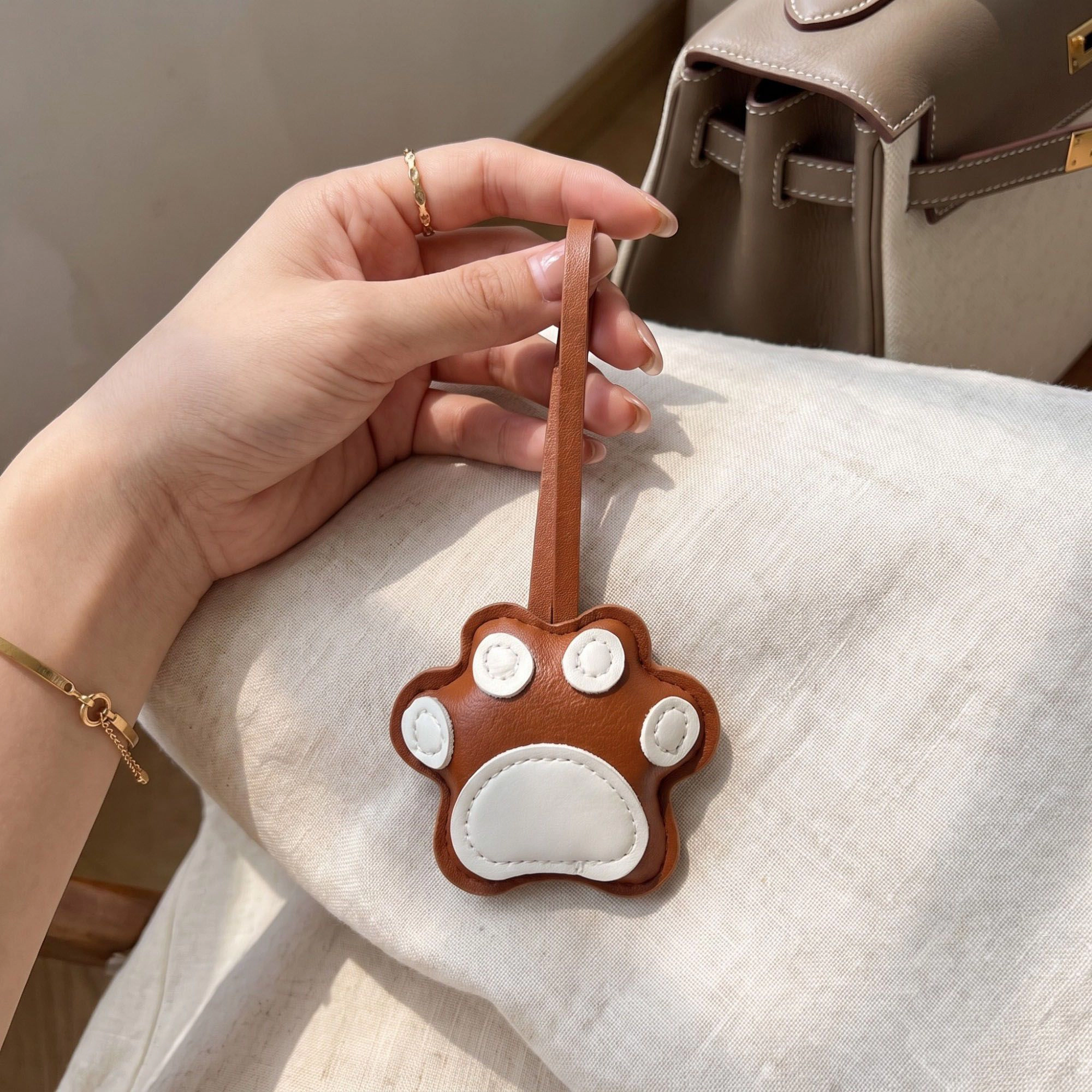 Alilang Women's 2-Piece Womens Faux Leather Paw Print Bag Charm with Long Hanging Strap and Padded Detail