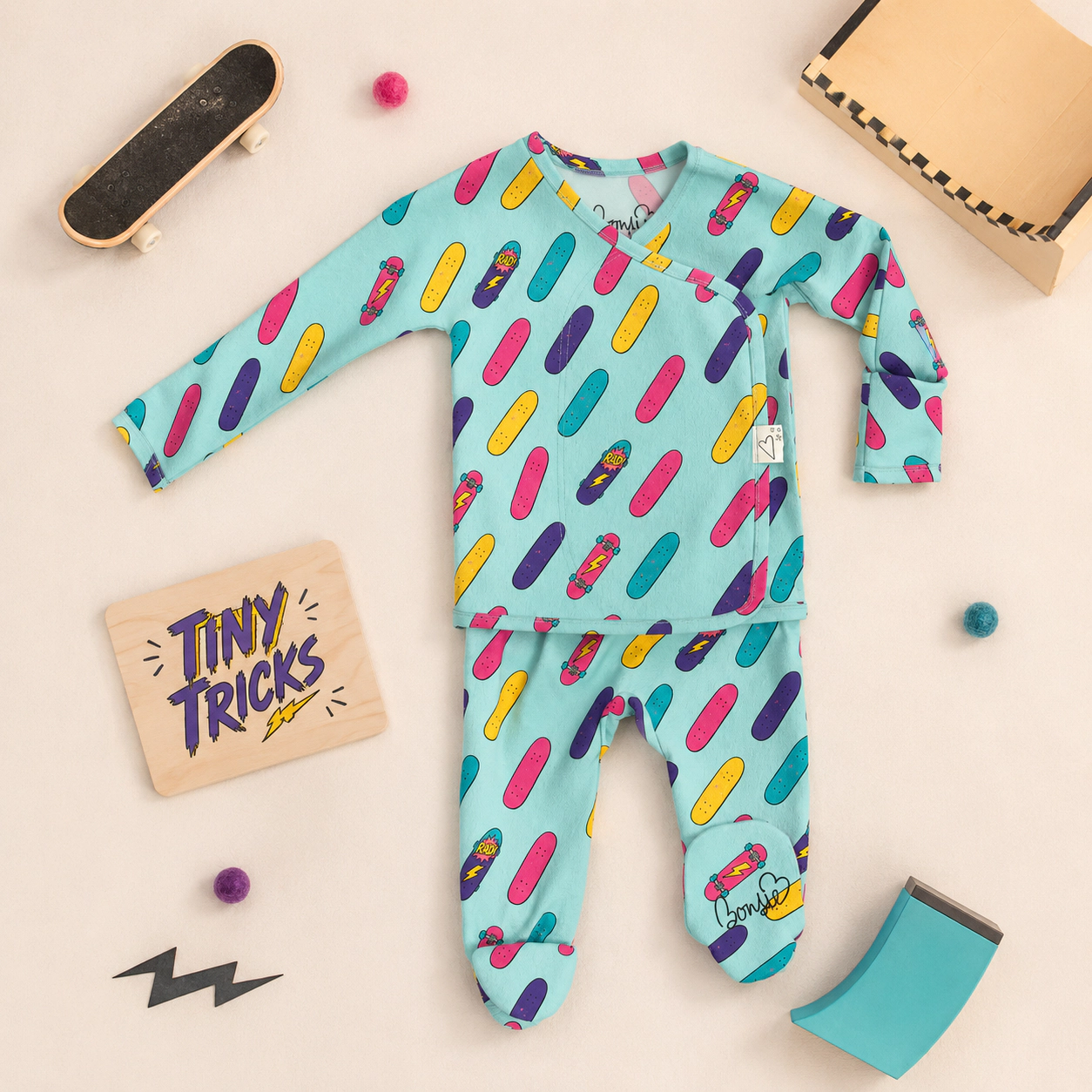Bonsie Footie - Tiny Tricks wrap-front newborn footed one-piece